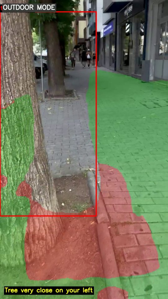 Camera view of a pavement with a tree trunk close on the left, marked in red, and the caption: Tree very close on your left.